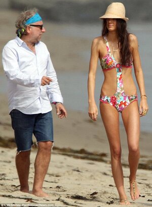 It's a tough job but someone's got to do it! Kendall Jenner frolics on the beach as she models...jpg
