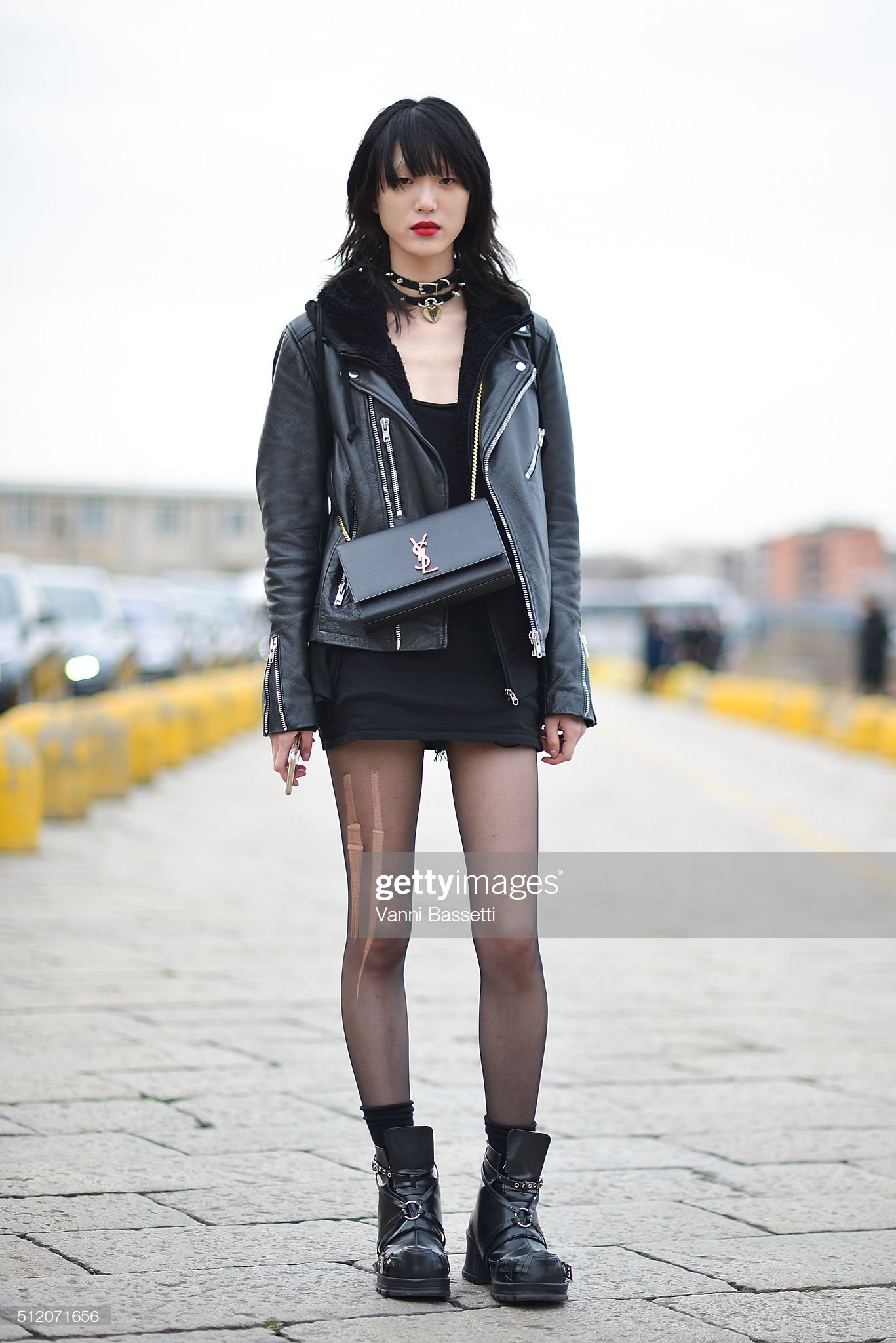 model-sora-choi-poses-with-a-ysl-bag-after-the-gucci-show-during-the-picture-id512071656
